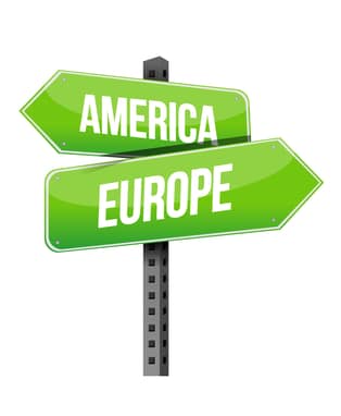 Road sign pointing to America and Europe