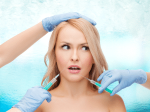 stockfresh 4320710 woman face and beautician hands with syringes resized