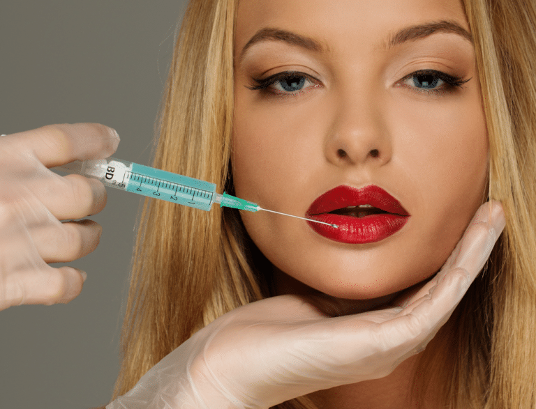 Beautiful young woman red lips with Botox syringe