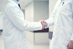 stockfresh 8910440 close up of doctors making handshake resized
