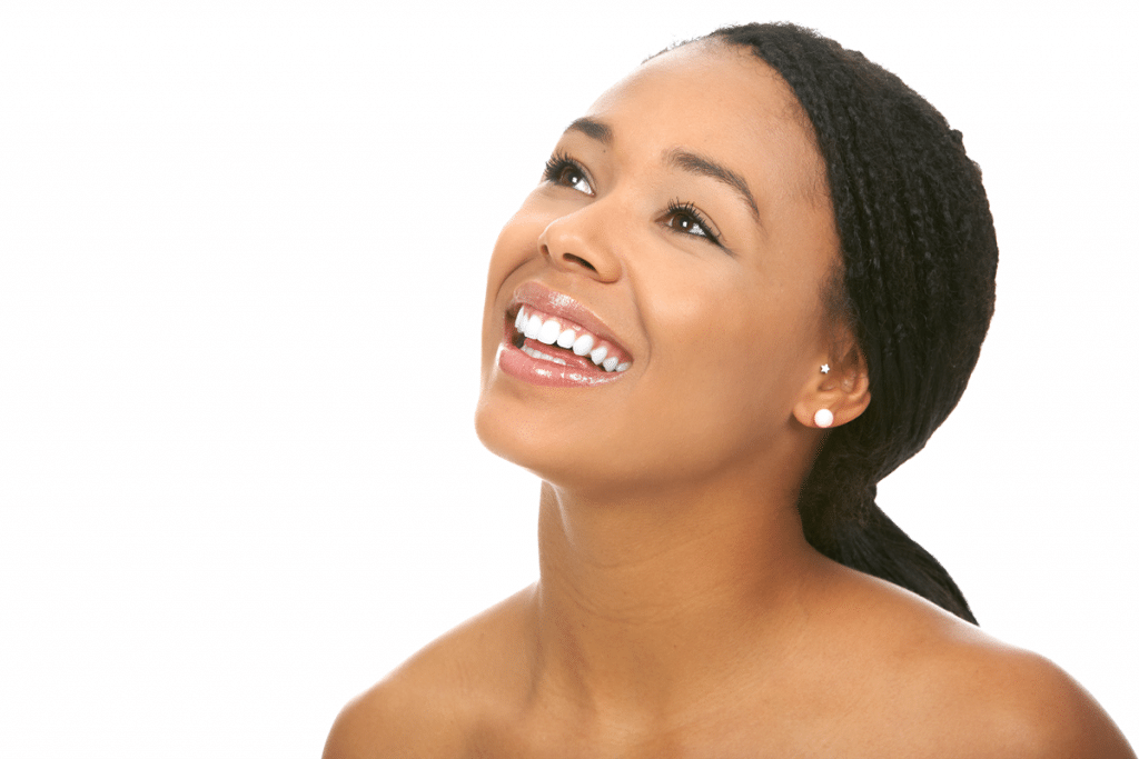 Smiling young woman looking up