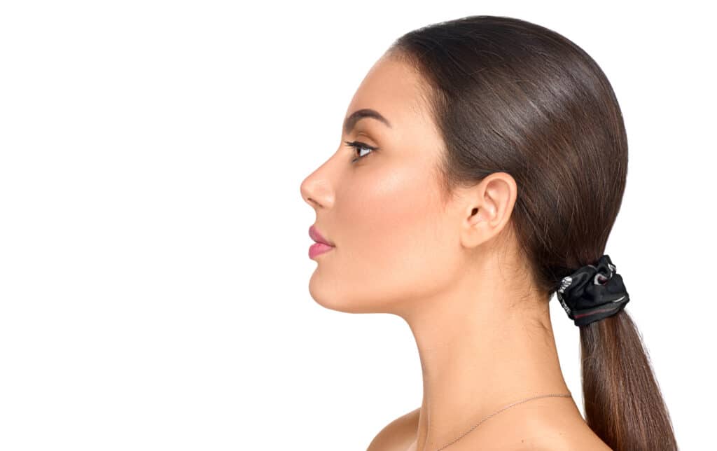 Profile picture of woman with dark hair in ponytail